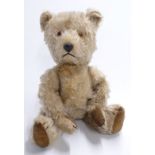 Vintage straw filled Teddy bear with blonde mohair, disc joints, felt pads and stitched features,