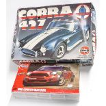 Two Airfix plastic model kits 1:16 scale Cobra 427 kit and 1:32 scale Mini Countryman WRC, both in