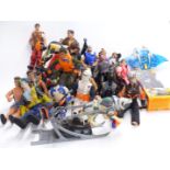 Twenty-one Action Man figures in various outfits together with vehicles, animals and accessories,