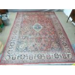 Turkoman rug with three guls on a pink/ wine ground, 312 x 204cm