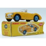 Dinky Toys diecast model Austin-Healy 100 Sport, with yellow body, beige driver, blue interior and