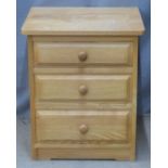 A contemporary light oak bedside chest of three graduated drawers and a dressing table mirror, W49 x