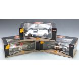 Three Maisto GT Racing 1:18 scale diecast model cars comprising BMW V12 LMR and Audi R8R Le Mans and
