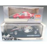 Two 1:18 scale diecast model vehicles Sun Star Lotus Elise 111S 1032 and Hot Wheels Racing McLaren