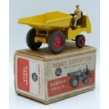 Dinky Supertoys diecast model Dumper Truck with yellow body, red hubs and beige driver, 562, in