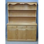 A contemporary light oak or ash dresser, W133 x D49 x H173cm