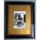 Framed photograph of Eric Williams on his 1921 TT wining AJS, overall size 51 x 41cm