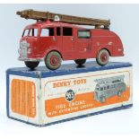 Dinky Toys diecast model Fire Engine With Extending Ladder, with red body and hubs, brown ladder and