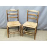 Pair of Cotswold School Arts and Crafts oak ladderback chairs