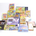 A collection of vintage video games, puzzles and card games including Playstation games, Rubics