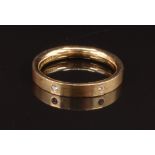 An 18ct gold eternity ring with a matte finish, set with diamonds, size N, 4.7g