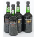 Four bottles of Cockburn's Special Reserve Port, three 1 litre 20% vol and one 750ml 20% vol