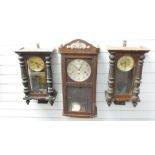 Three circa Edwardian wall clocks, one a three train example, the others two train striking on a