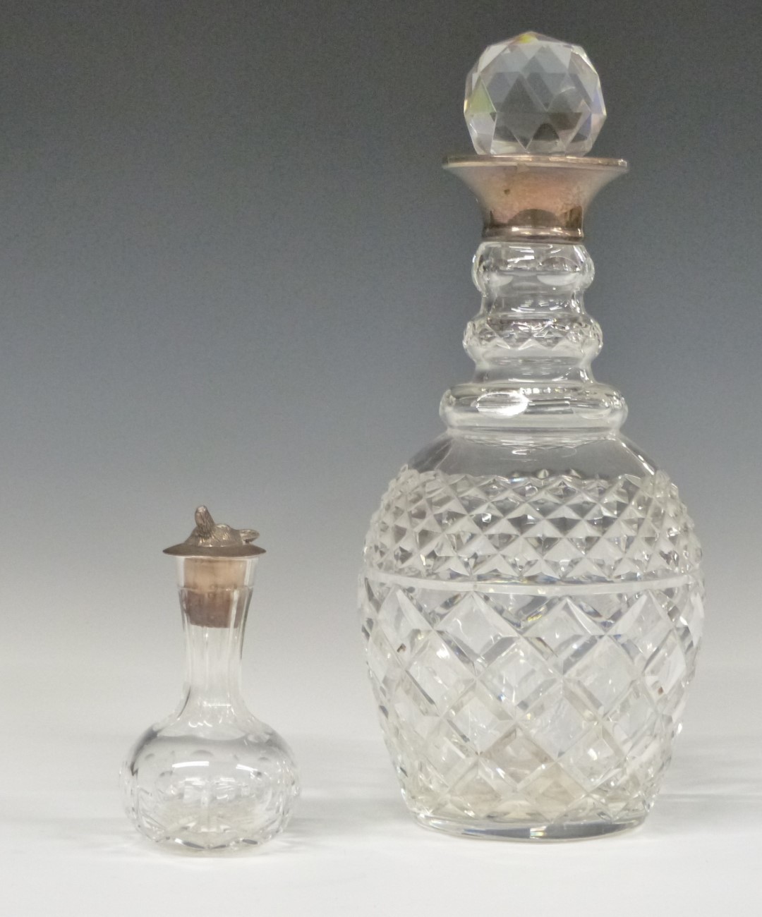 Modern hallmarked silver-mounted cut glass decanter, height 28cm, and a small cut glass vessel