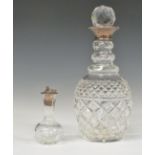 Modern hallmarked silver-mounted cut glass decanter, height 28cm, and a small cut glass vessel
