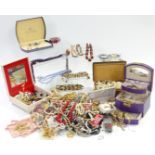 A collection of costume jewellery including brooches, necklaces, etc