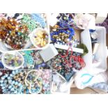 A collection of costume jewellery including vintage necklaces and beads