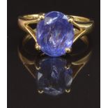 An 18ct gold ring set with an oval cut tanzanite, size K, 4.7g