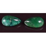 A pair of loose pear cut emeralds, each approximately 4.25ct