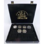 Six silver proof commemorative crown sized coins in a collector's case