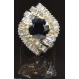 An 18ct gold metamorphic ring / pendant set with a round cut sapphire of approximately 2.2ct