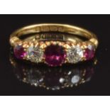 Edwardian 18ct gold ring set with cushion cut rubies and old cut diamonds (approx 0.2ct each),