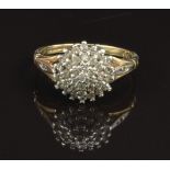 A 9ct gold ring set with diamonds in a cluster, size K, 2.3g