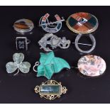 A collection of silver brooches including Victorian agate, Victorian malachite ivy, Connemara marble