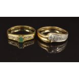 Two yellow metal rings, one set with an emerald and cubic zirconia, the other cubic zirconia, size T