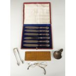 Cased set of hallmarked silver handled knives together with a pair of hallmarked silver sugar tongs,
