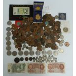 An amateur collection of UK and overseas coinage, banknotes and modern crowns, including a bronze