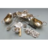 Collection of silver plated ware including asparagus tongs, double sided ladle with sieve, stilton