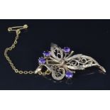 A 9ct gold brooch set with amethysts, 4.5cm, 5.9g