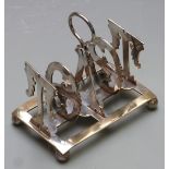 Silver plated toast rack with the bars formed as the word toast, length 12cm