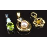 Three pendants comprising 9ct white gold set with an opal and peridot, 9ct gold set with a pearl and