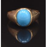 A yellow metal ring set with faux turquoise, size O, 2.7g