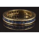 An 18ct gold eternity ring set with square cut sapphires, size N, 5.4g