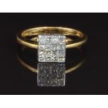 An 18ct gold ring set with approximately 0.5ct of square cut diamonds, size N, 3.6g