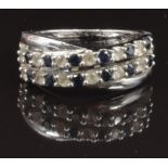 A 9ct white gold ring set with sapphires and cubic zirconia, size O, 4.7g