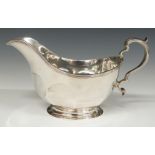 A hallmarked silver gravy boat, Birmingham 1931, maker Adie Brothers but with additional import