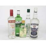 Three bottles of gin comprising Gordon's Dry London Gin 37.5%, Tesco London Dry Gin 37.5% vol,