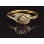 An 18ct gold ring set with diamonds in a twisted platinum setting, size S, 2.8g