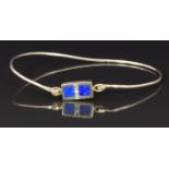 A 9ct gold bangle set with lapis lazuli and diamonds, 3.2g