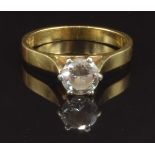 An 18ct gold ring set with a round brilliant cut diamond of approximately 0.6ct, size K, 2.9g