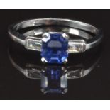 A platinum ring set with an untreated Asscher cut sapphire and a baguette cut diamond to each