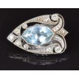 A 9ct white gold c1920 clip set with a marquise mixed cut aquamarine and transitional cut