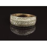 A 9ct gold ring set with four rows of diamonds, size O, 3.5g