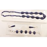 A beaded lapis lazuli necklace, a silver bracelet set with lapis lazuli and similar earrings