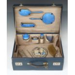 Blue leather travelling vanity case with fitted interior and blue guilloché enamel mounted