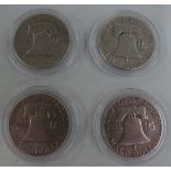 Four USA Liberty half dollars comprising two 1951, 1952 and 1957 examples